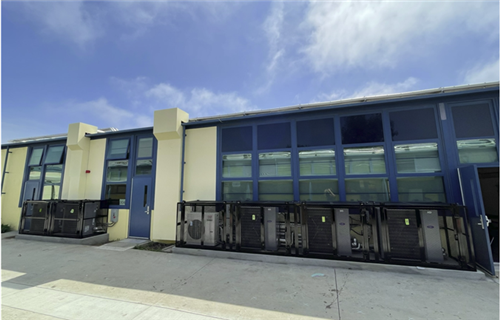 Will Rogers condensate unites along with cages at Will Rogers elementary